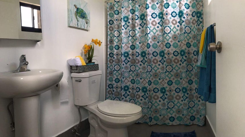 San Gil Apartments Bathroom Guam San Gil Apartments Bathroom with toilet, shower and pedestal sink